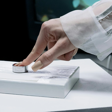 Image of a person pushing a button.